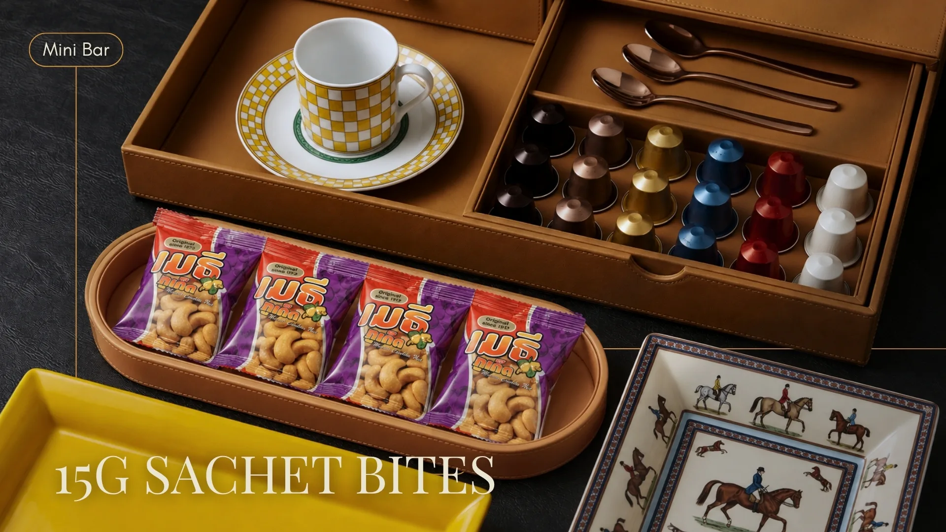 15 gram cashew sachets set on a leather minibar tray beside a coffee service