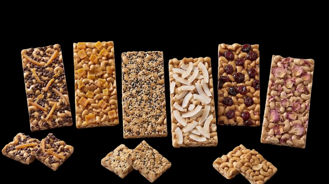 Cashew nut bar assortment on a white background