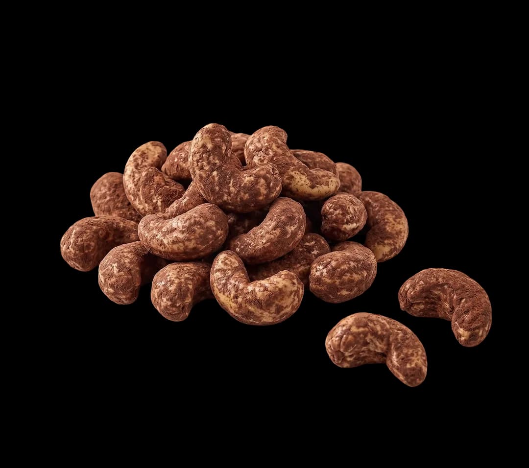 Cocoa-coated cashews on a white background