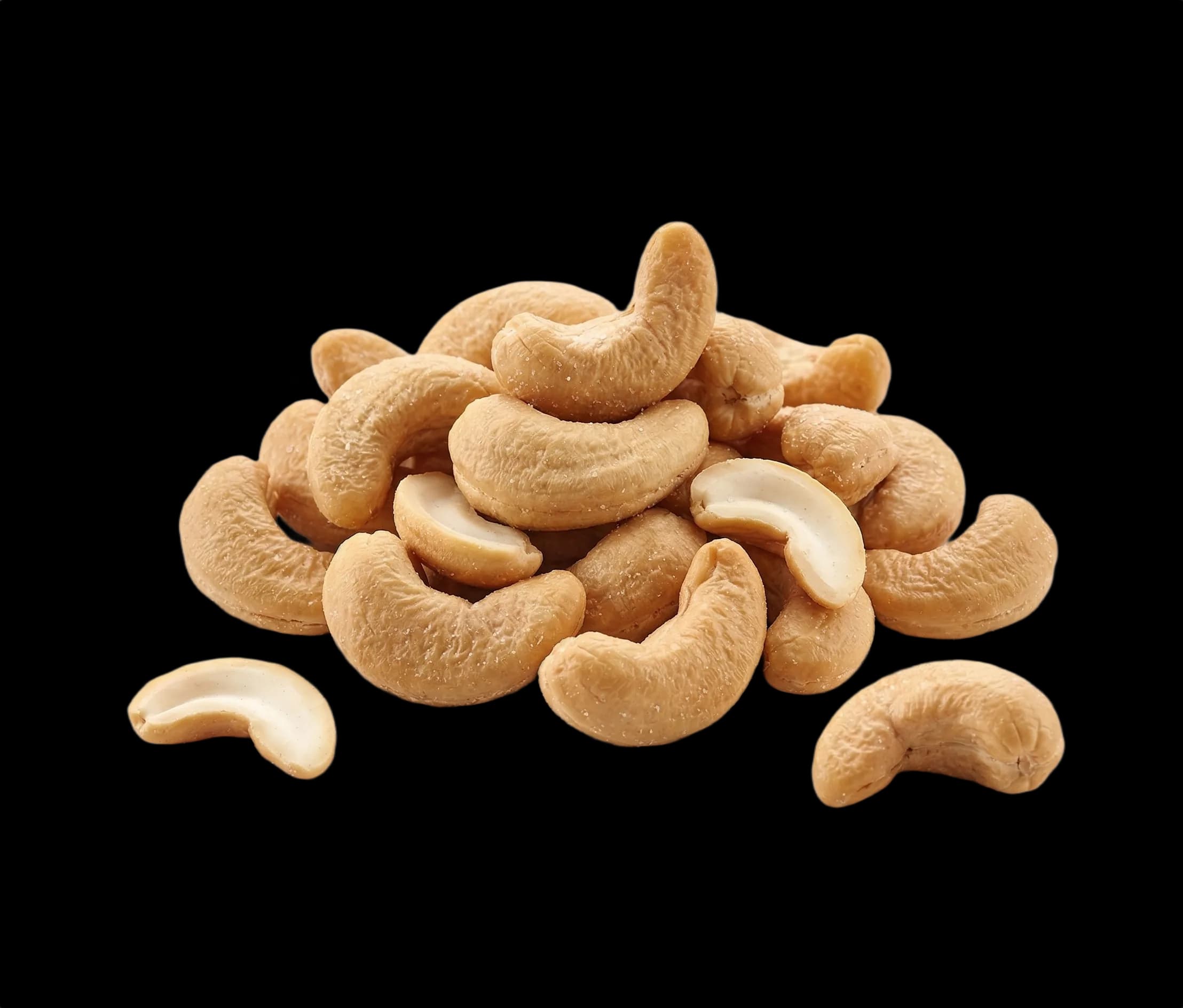 Natural roasted cashews on a white background